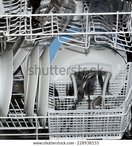 dishwasher lots of dishes and glasses