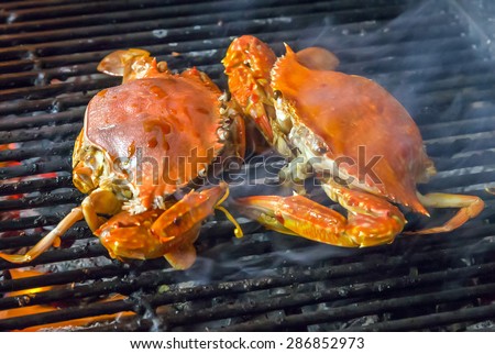seafood crab by fire and BBQ Flames. Restaurant Barbecue at the night market