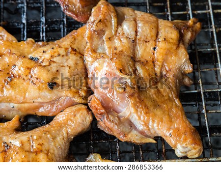 Chicken by fire and BBQ Flames. Restaurant Barbecue at the night market