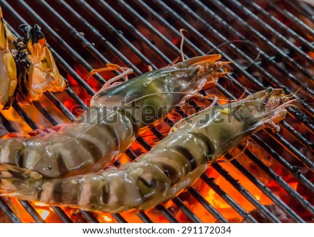 prawn grilled barbecued mixed seafood in BBQ Flames.