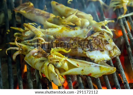 squid grilled barbecued seafood in BBQ Flames.