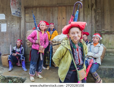 TA PHIN, LAO CAI, VIETNAM - NOV 21, 2014: Woman from Red Dao minority group wearing traditional headdress near Ban Ho village, Sapa District, Lao Cai, Vietnam.