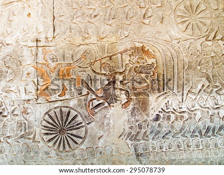 relief carving of gods fighting demons. Inner wall of the temple of Angkor Wat, Siem Reap, Cambodia.