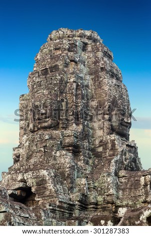 Ancient stone faces of king Bayon Temple Angkor Thom, Cambodia. Ancient monument Khmer architecture.