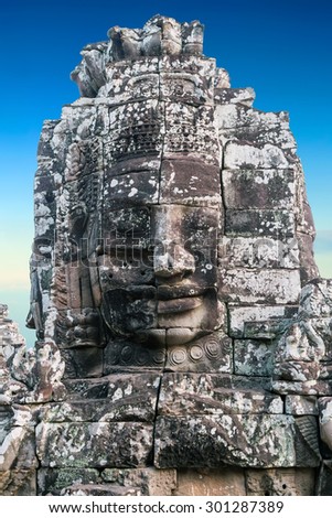 ruin stone faces of king Bayon Temple Angkor Thom, Cambodia. Ancient monument Khmer architecture.