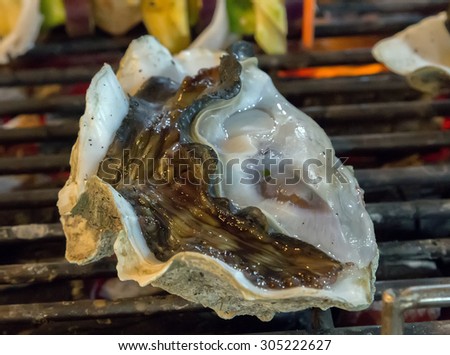 shell oysters Barbecue Grill cooking seafood.