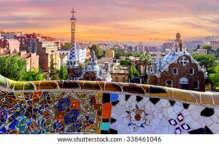 sunrise Parc Guell designed by Antoni Gaudi located on Carmel Hill, bench covered with tile-shard mosaic, Barcelona, Spain.