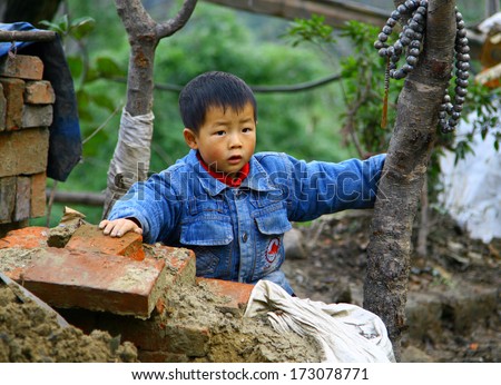 WUDANGSHAN, CHINA - NOV 1, 2007: Unidentified little chinese boy. According to traditional  beliefs Chinese prefer sons to have support in old age. As a result, now for 100 girls accounts more than 120 boys