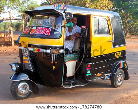 GOA, INDIA - FEB 11, 2014: Indian auto rickshaw. Auto rickshaws (mototaxi or tuk-tuk) are a common means of public transportation in many countries in the world