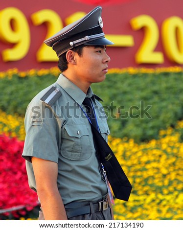 BEIJING, CHINA- JUL 3, 2011: A soldier stands guard at the Tiananmen square. In July 2011, the Chinese people celebrated the ninety years since the founding of the Communist Party of China