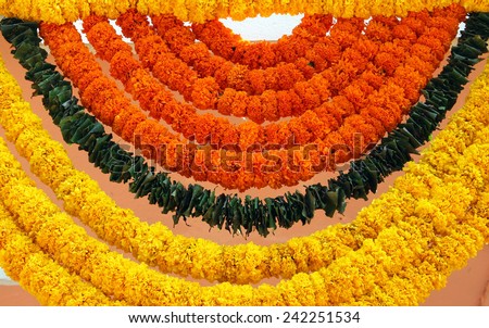 Indian festive decoration - a garland of orange and yellow Marigold (Tagetes) flowers