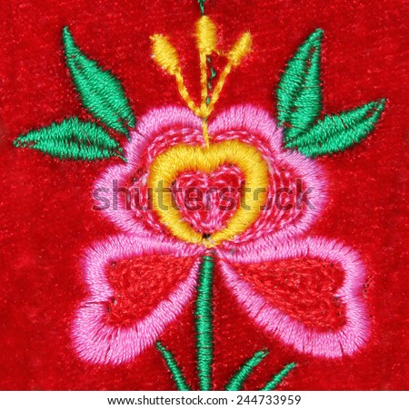 handmade embroidery flower on red velvet