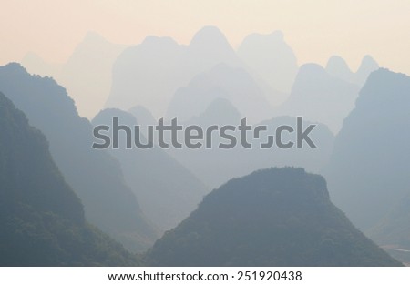 Mystical landscape of misty karst peaks - view from Moon hill in Yangshuo, China