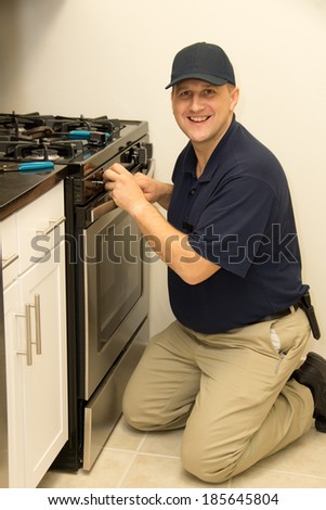 Service technician repairs stove