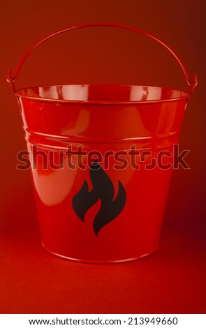 Fire bucket on red background
