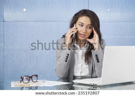 Businesswoman talking in telephone conversation with a client
