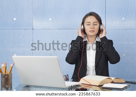 Relaxed woman with headphones listening to music