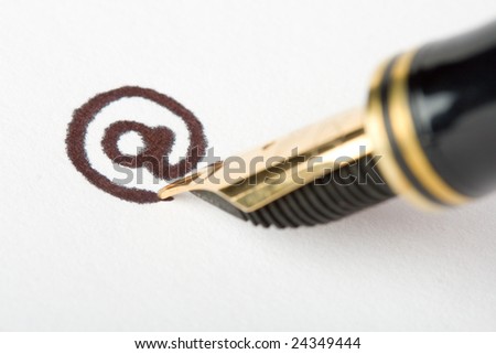 close-up gold pen writing email address