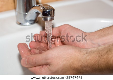 washing the hands in bathroom