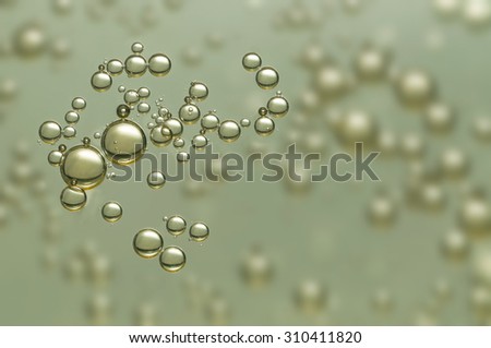 Nice golden champagne bubbles over a blurred background
