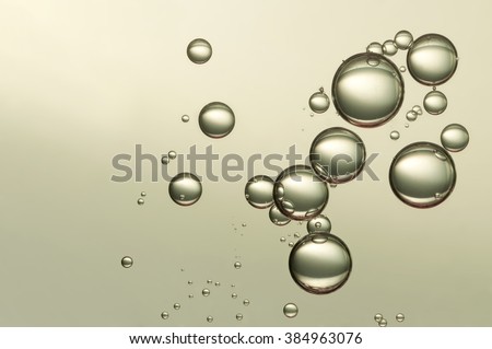 Nice big group fizz bubbles soars over a light background