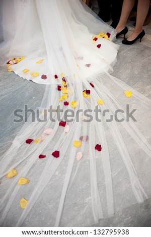 Red and Yellow Flowers in a White Wedding Dress