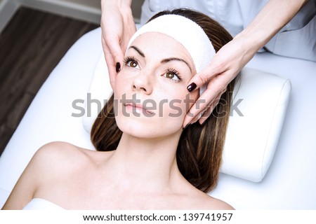 woman in a beauty clinic by becoming a massage