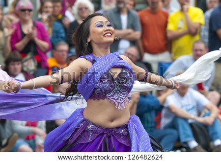 SEATTLE, WA - JUNE 16, 2012: A participant dances of the annual Fremont Summer Solstice Day Parade  on June 16, 2012 in Seattle. This event is dedicated to celebrate the beginning of the summer.