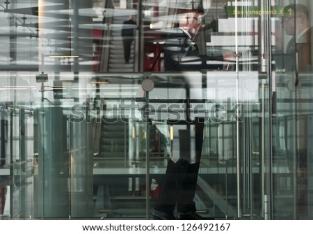 Multiple layers and reflection of a modern airport building.