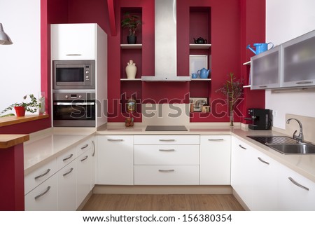 Modern Kitchen Interior With Red Walls And White Furniture