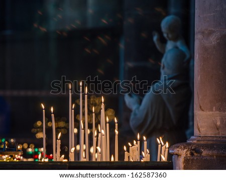 REIMS FRANCE 21 AUG: candles in the cathedral of reims on 21 August 2013. It is the seat of the Archdiocese of Reims, where the kings of France were crowned