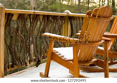 Snowy Deck with Adirondack Chairs