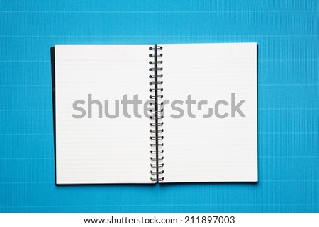 Open book with lines  on a blue crepe paper background