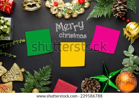 Christmas decorations and ornaments on table with label tag for text.