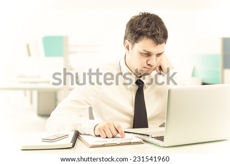 businessman working with laptop computer at office desk, thinking ,clipping path,vintage