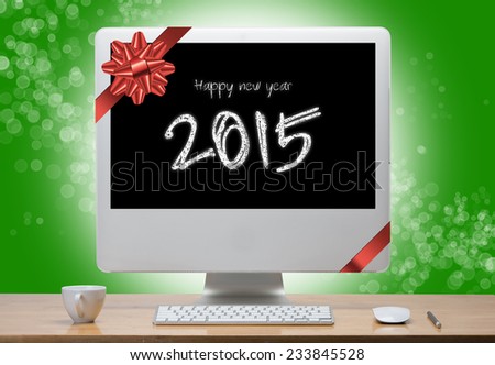Computer display with text  happy new year 2015 on screen.clipping path