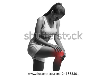 Woman having knee pain isolated on a white background with clipping path