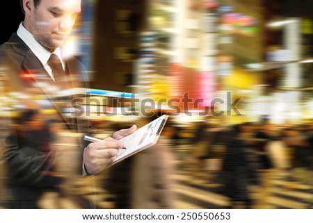 Businessman at rush hour walking in the city street,Double exposure and motion blur