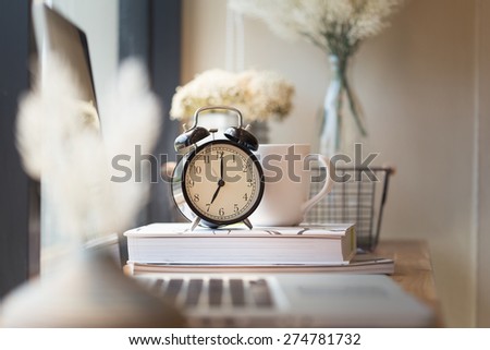 photo of clock on office desk.