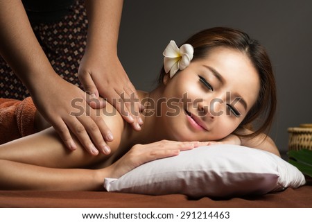 Asian woman having massage and spa salon Beauty treatment concept. She is very relaxed