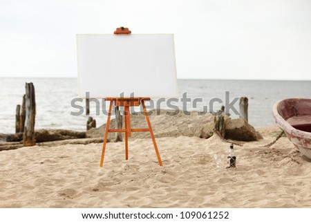 Easel ready for painting, standing in a empty beach