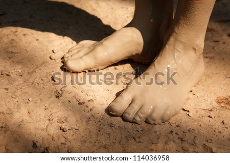 Feet in mud close-up