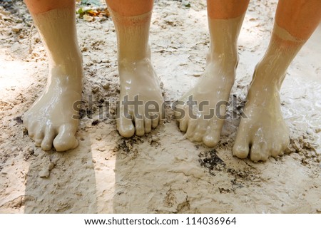 Four feet in mud close-up