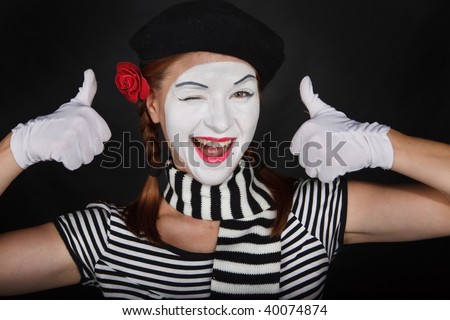 Portrait of a sad mime comedian,on black background