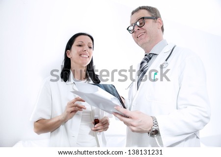 serious medical workers looking at documentation