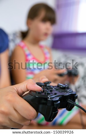 mother and child playing a video game