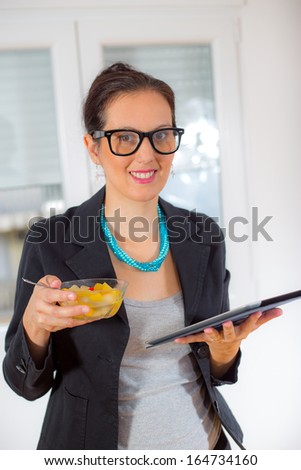 business woman eating fruits salad