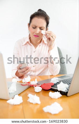 Young businesswoman crying at the office