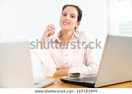 Woman trying the smell of a perfume in the office