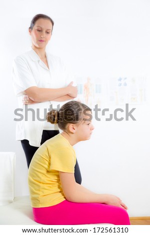 chiropractor and patient during an office visit